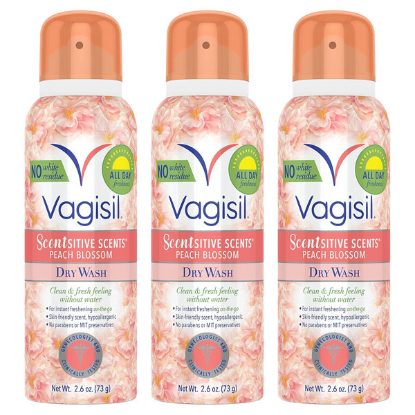 Three cans of Vagisil Scentsitive Scents Feminine Dry Wash Deodorant Spray 2.6oz each are displayed side by side, featuring peach floral designs—ideal for freshening intimate skin. 3 Pack from Vagisil.